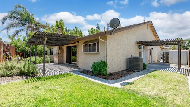 3 Clemson Ct, Woodland, CA 95695 - rear view of house with a pergola, central AC, a patio, and stucco siding