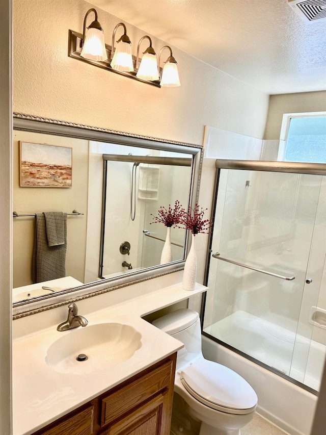 3 Clemson Ct, Woodland, CA 95695 - bathroom featuring bath / shower combo with glass door, vanity, and toilet