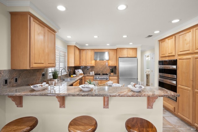 6 Tyler St, Novato, CA 94947 - kitchen featuring appliances with stainless steel finishes, a sink, wall chimney range hood, recessed lighting, and a peninsula