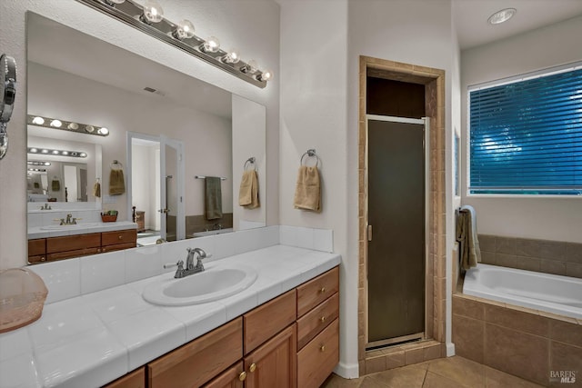 17962 Bunker Rd, Hidden Valley Lake, CA 95467 - bathroom featuring a stall shower, tile patterned flooring, a garden tub, and vanity