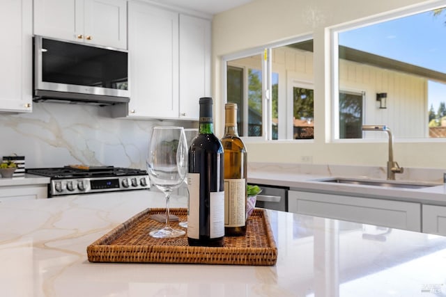 8017 Washington Ave, Sebastopol, CA 95472 - kitchen with appliances with stainless steel finishes, white cabinets, and a sink