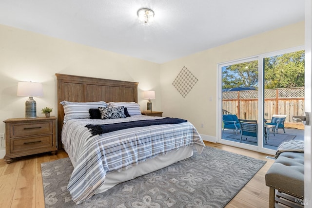 8017 Washington Ave, Sebastopol, CA 95472 - bedroom featuring access to outside, light wood-style floors, and baseboards