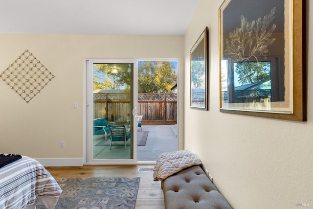 8017 Washington Ave, Sebastopol, CA 95472 - bedroom featuring access to exterior, wood finished floors, and baseboards