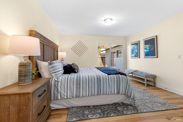 8017 Washington Ave, Sebastopol, CA 95472 - bedroom with access to outside, light wood finished floors, and baseboards