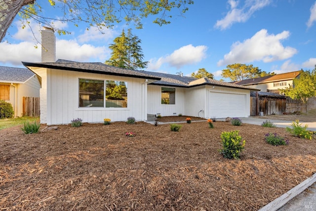 8017 Washington Ave, Sebastopol, CA 95472 - ranch-style house featuring fence, a chimney, a garage, and concrete driveway