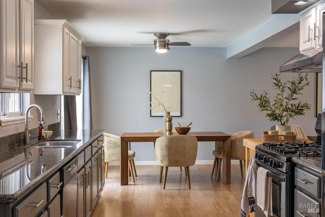 2835 Owens St, Fairfield, CA 94534 - kitchen featuring appliances with stainless steel finishes, a sink, ceiling fan, and dark stone countertops