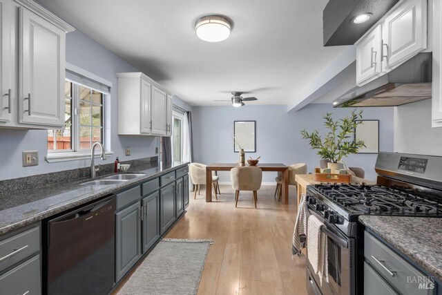 2835 Owens St, Fairfield, CA 94534 - kitchen featuring dishwashing machine, stainless steel range with gas cooktop, a sink, white cabinets, and light wood-style flooring