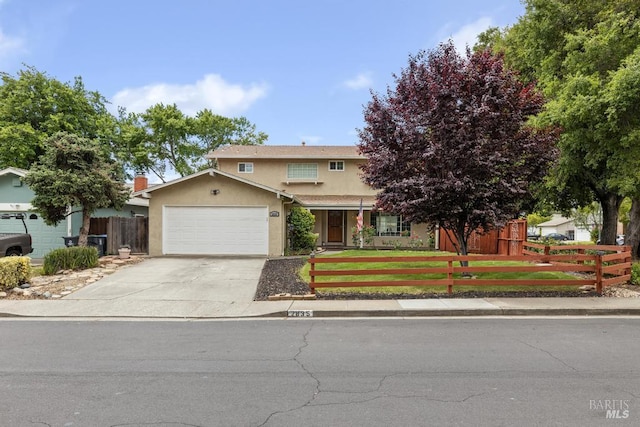 2835 Owens St, Fairfield, CA 94534 - view of front of house with a fenced front yard, stucco siding, a garage, and driveway