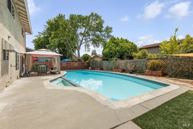 2835 Owens St, Fairfield, CA 94534 - view of swimming pool featuring a gazebo, a pool with connected hot tub, a fenced backyard, and a patio