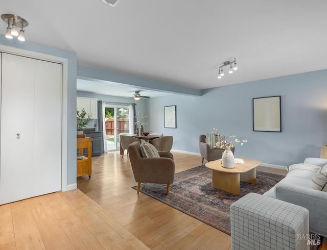 2835 Owens St, Fairfield, CA 94534 - living area with wood finished floors, a ceiling fan, and track lighting
