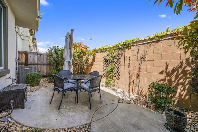 2056 Parsons Dr, Fairfield, CA 94533 - view of patio / terrace featuring central air condition unit, outdoor dining area, and a fenced backyard