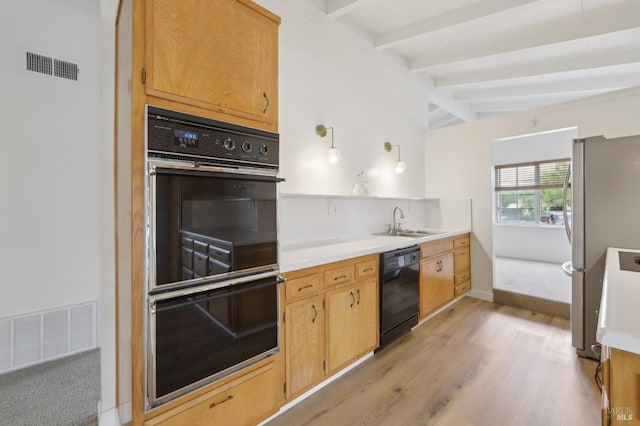 2889 Keller Ct, Napa, CA 94558 - kitchen with black appliances, a sink, light wood-style floors, light countertops, and baseboards