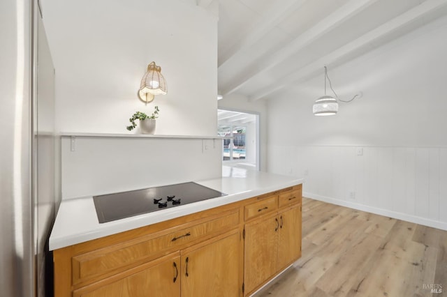 2889 Keller Ct, Napa, CA 94558 - kitchen with black electric stovetop, light countertops, light wood-style floors, and freestanding refrigerator