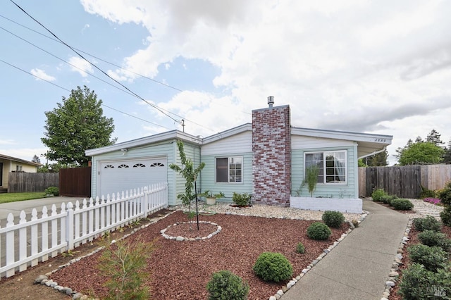 2889 Keller Ct, Napa, CA 94558 - view of front of house with driveway, a garage, fence, and a chimney