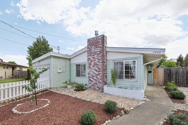 2889 Keller Ct, Napa, CA 94558 - view of front facade with an attached garage, fence, and a chimney