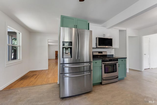 2951 Thorn Rd, Sebastopol, CA 95472 - kitchen featuring appliances with stainless steel finishes, green cabinets, baseboards, dark countertops, and beam ceiling