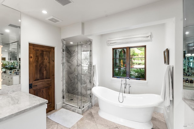 7035 Silverado Trl, Napa, CA 94558 - bathroom with a marble finish shower, a freestanding tub, vanity, baseboards, and recessed lighting