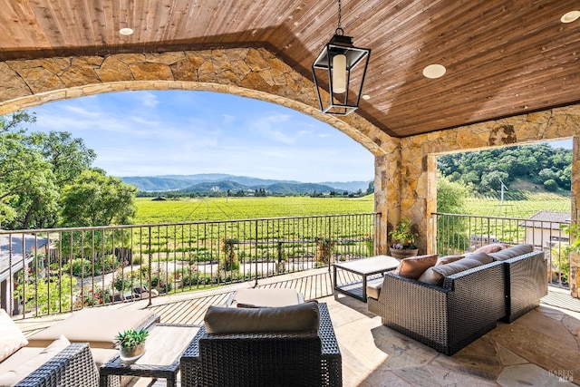 7035 Silverado Trl, Napa, CA 94558 - view of patio with an outdoor living space, a view of rural / pastoral area, a mountain view, and a balcony
