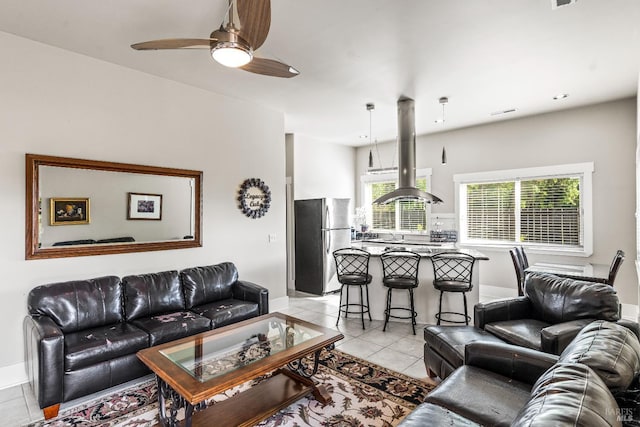 7035 Silverado Trl, Napa, CA 94558 - living area featuring light tile patterned flooring, baseboards, and a ceiling fan