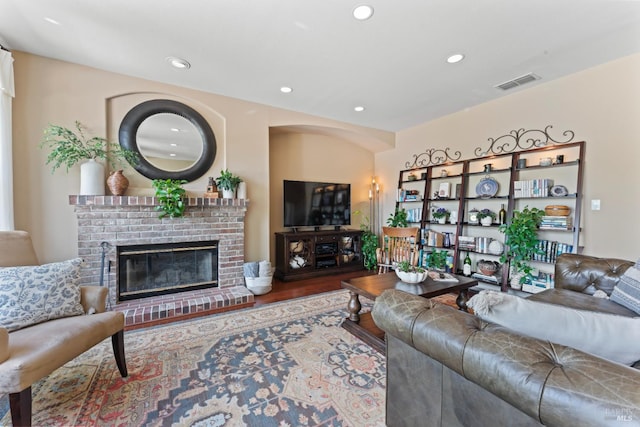 1261 Landmark Dr, Vallejo, CA 94591 - living area with recessed lighting, wood finished floors, and a brick fireplace