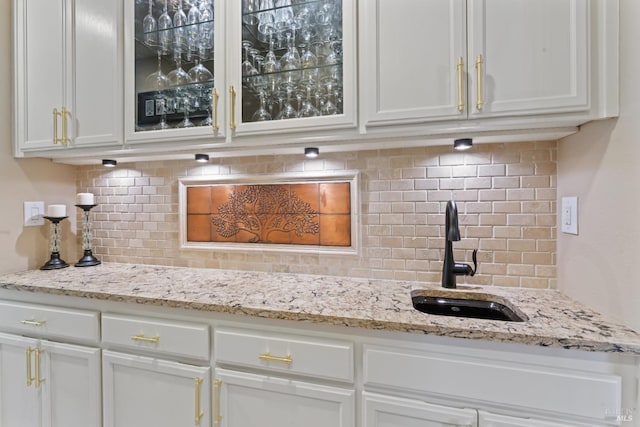 1261 Landmark Dr, Vallejo, CA 94591 - kitchen with a sink, backsplash, and white cabinets