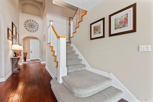 1261 Landmark Dr, Vallejo, CA 94591 - stairs with arched walkways, wood-type flooring, and baseboards