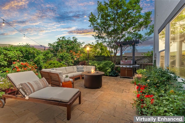 1261 Landmark Dr, Vallejo, CA 94591 - patio terrace at dusk featuring area for grilling, an outdoor living space with a fire pit, and fence