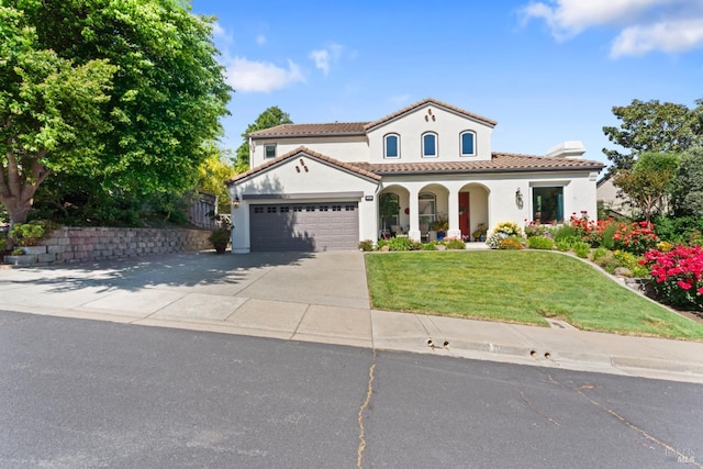 1261 Landmark Dr, Vallejo, CA 94591 - mediterranean / spanish home with a porch, stucco siding, concrete driveway, an attached garage, and a tiled roof