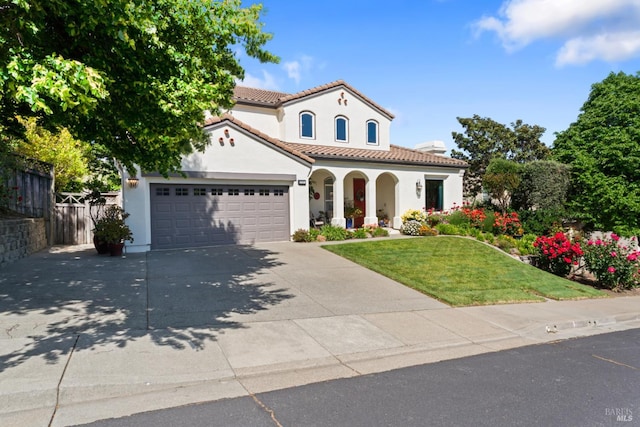 1261 Landmark Dr, Vallejo, CA 94591 - mediterranean / spanish house with a porch, stucco siding, a garage, concrete driveway, and a tiled roof