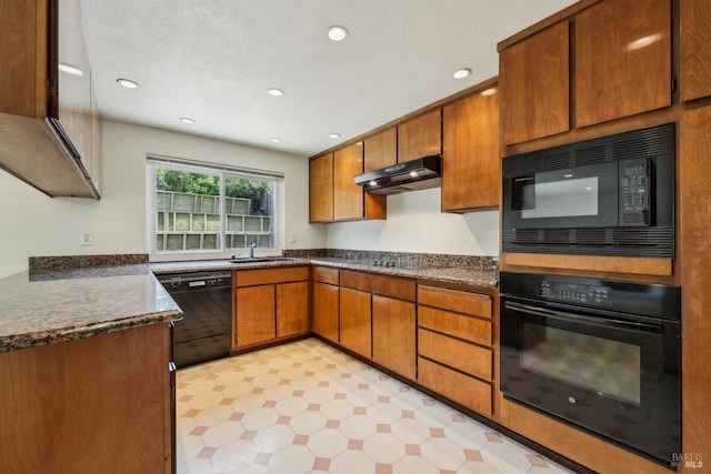 543 Sandy Way, Benicia, CA 94510 - kitchen with black appliances, light flooring, brown cabinetry, under cabinet range hood, and recessed lighting