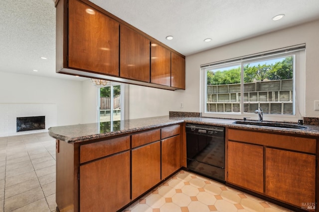 543 Sandy Way, Benicia, CA 94510 - kitchen featuring dishwasher, a sink, a peninsula, recessed lighting, and a brick fireplace
