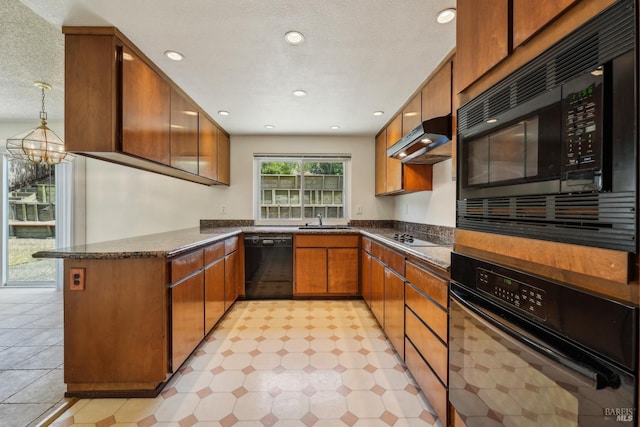 543 Sandy Way, Benicia, CA 94510 - kitchen featuring black appliances, under cabinet range hood, a sink, a peninsula, and brown cabinetry