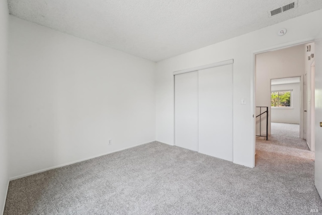 543 Sandy Way, Benicia, CA 94510 - unfurnished bedroom with carpet flooring, a closet, a textured ceiling, and baseboards