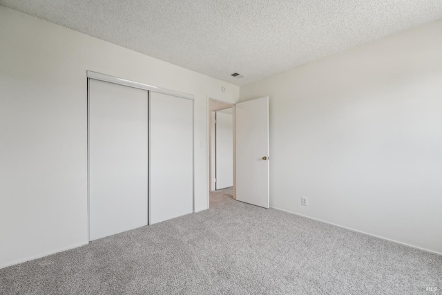 543 Sandy Way, Benicia, CA 94510 - unfurnished bedroom with carpet, a textured ceiling, and a closet