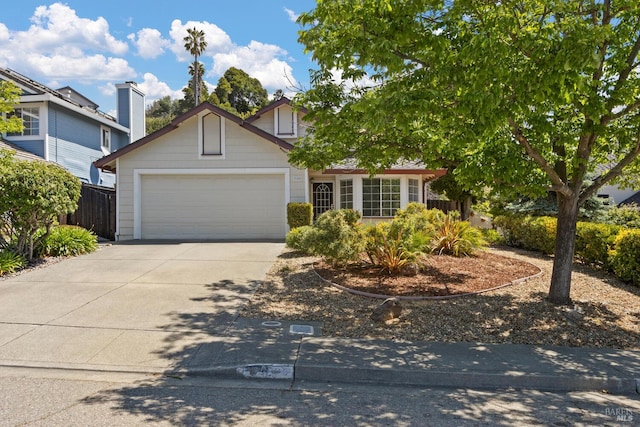 358 Paddlewheel Dr, Vallejo, CA 94591 - view of property hidden behind natural elements featuring a garage, concrete driveway, and fence