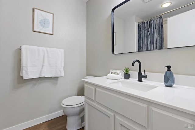 358 Paddlewheel Dr, Vallejo, CA 94591 - full bath with wood finished floors, baseboards, toilet, vanity, and a shower with shower curtain