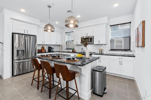 336 Pear Tree Ln Unit D, Napa, CA 94558 - kitchen featuring appliances with stainless steel finishes, light tile patterned floors, white cabinets, and recessed lighting