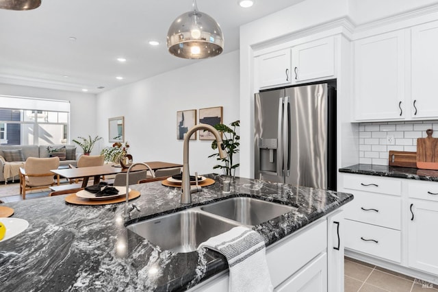 336 Pear Tree Ln Unit D, Napa, CA 94558 - kitchen with stainless steel fridge with ice dispenser, a sink, white cabinetry, dark stone countertops, and recessed lighting