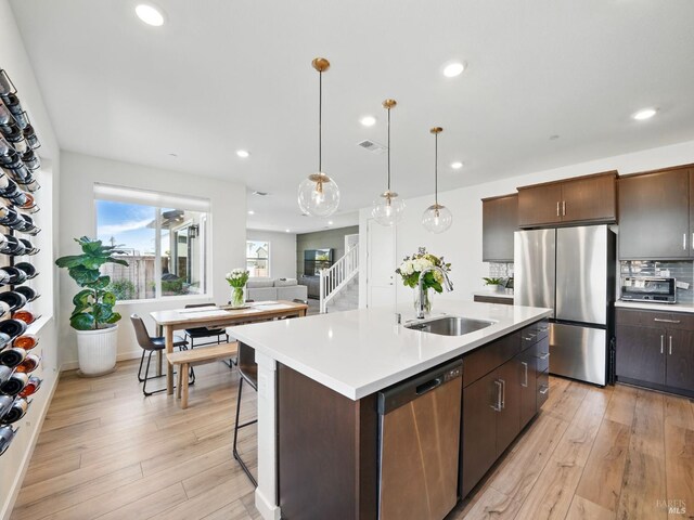 2471 Lake Club Dr, Fairfield, CA 94533 - kitchen featuring appliances with stainless steel finishes, light wood-style floors, light countertops, and recessed lighting