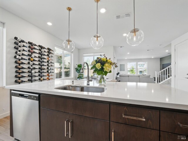 2471 Lake Club Dr, Fairfield, CA 94533 - kitchen featuring dishwasher, a sink, light countertops, dark brown cabinets, and recessed lighting
