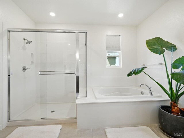2471 Lake Club Dr, Fairfield, CA 94533 - bathroom with a garden tub, a shower stall, tile patterned flooring, and recessed lighting