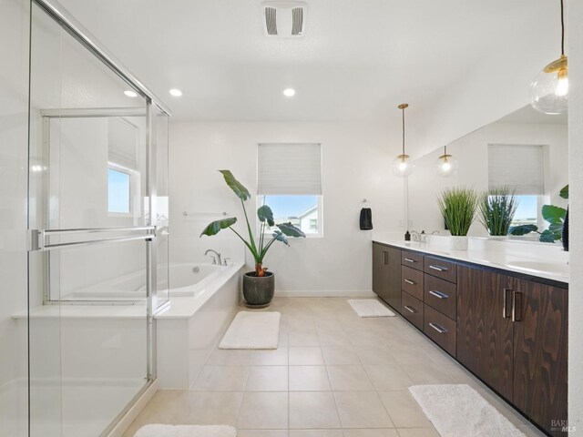 2471 Lake Club Dr, Fairfield, CA 94533 - bathroom featuring double vanity, a garden tub, tile patterned floors, baseboards, and a shower stall