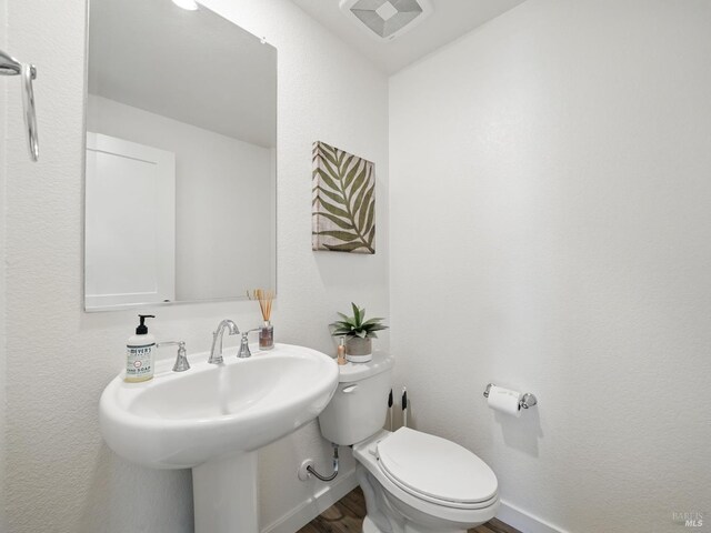 2471 Lake Club Dr, Fairfield, CA 94533 - bathroom with toilet and wood finished floors