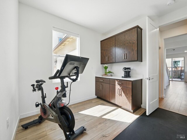 2471 Lake Club Dr, Fairfield, CA 94533 - workout room with light wood-style flooring and baseboards