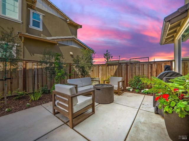 2471 Lake Club Dr, Fairfield, CA 94533 - patio terrace at dusk featuring a patio area, an outdoor fire pit, and a fenced backyard