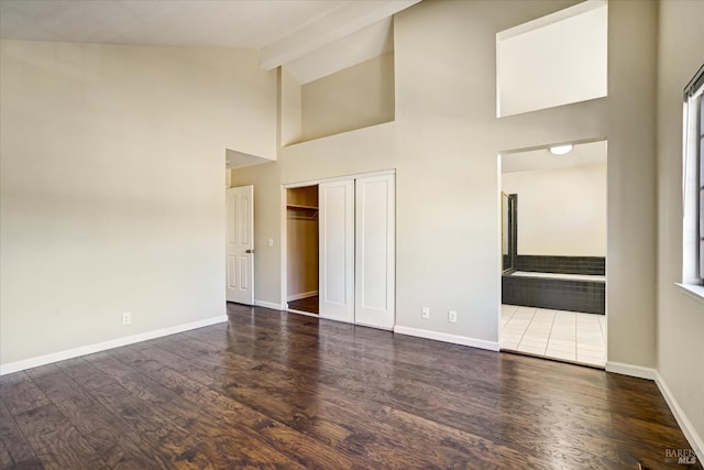 149 Countryview Ct, Vallejo, CA 94591 - unfurnished bedroom with high vaulted ceiling, wood finished floors, baseboards, and a closet