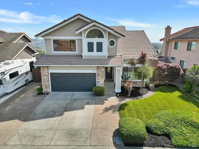 149 Countryview Ct, Vallejo, CA 94591 - view of front facade with a garage, concrete driveway, stone siding, and a tiled roof