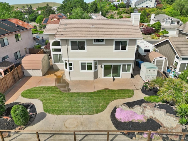 149 Countryview Ct, Vallejo, CA 94591 - back of property with a fenced backyard, an outbuilding, a patio, a tile roof, and a residential view