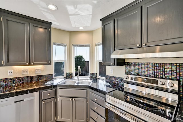 149 Countryview Ct, Vallejo, CA 94591 - kitchen featuring stainless steel appliances, tile countertops, a sink, under cabinet range hood, and decorative backsplash