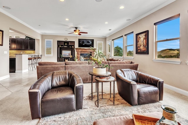 819 Bridle Ridge Dr, Fairfield, CA 94534 - living area featuring a glass covered fireplace, ceiling fan, recessed lighting, baseboards, and crown molding